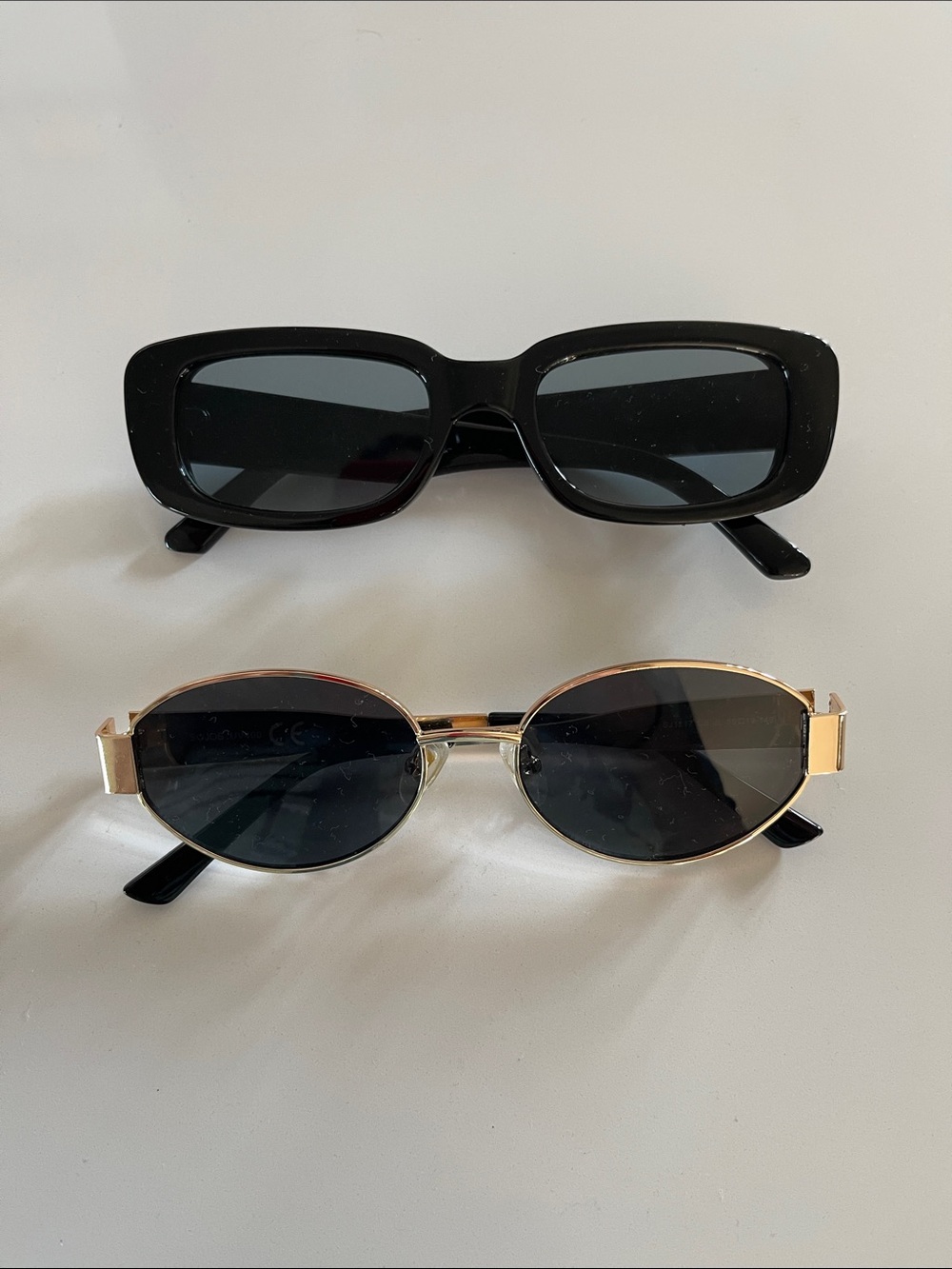 Two Pairs of Retro Sunglasses with Dark Lenses